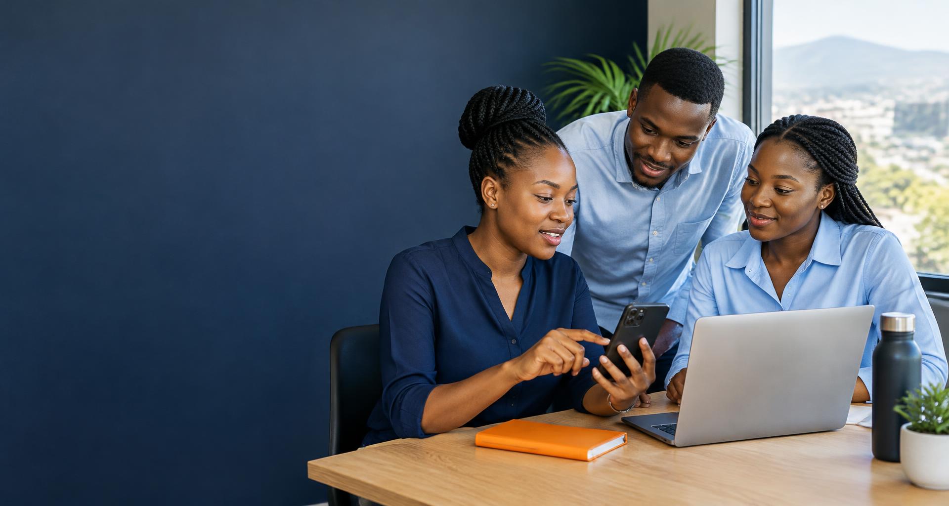 African professionals exploring financial technology together